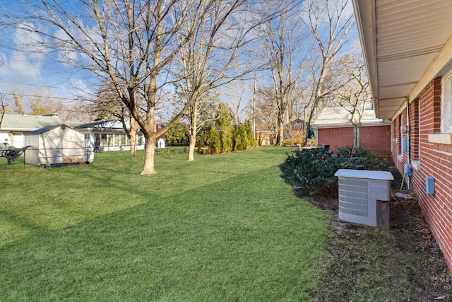 view of yard with central AC