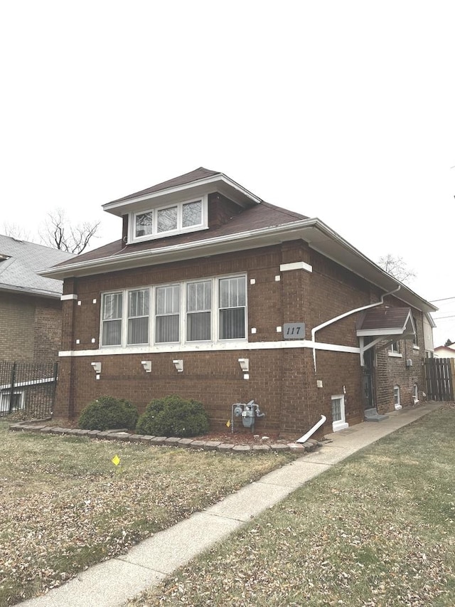 view of home's exterior featuring a lawn