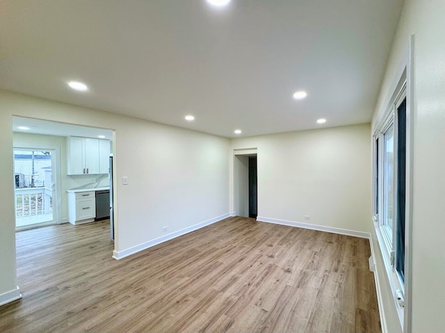 empty room with light hardwood / wood-style floors