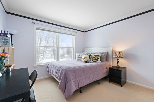 carpeted bedroom featuring ornamental molding and baseboards