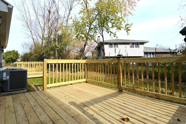 wooden deck with central air condition unit