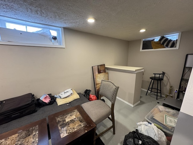 office featuring concrete flooring and a textured ceiling