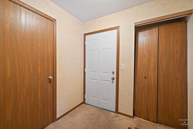 interior space featuring light carpet