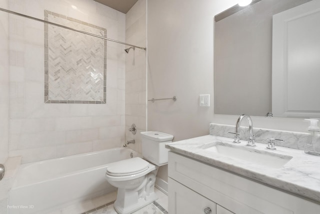 full bathroom featuring tile patterned floors, tiled shower / bath combo, toilet, and vanity