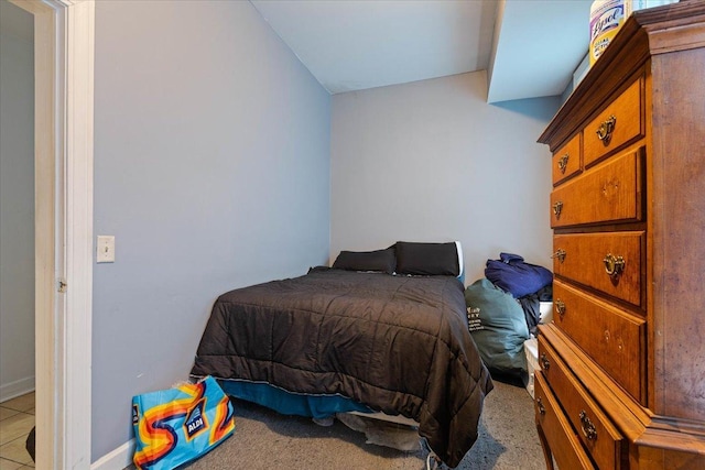 bedroom featuring light colored carpet