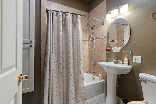 bathroom with tile patterned flooring, toilet, and shower / tub combo with curtain