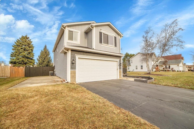 view of front of house with a front lawn and a garage