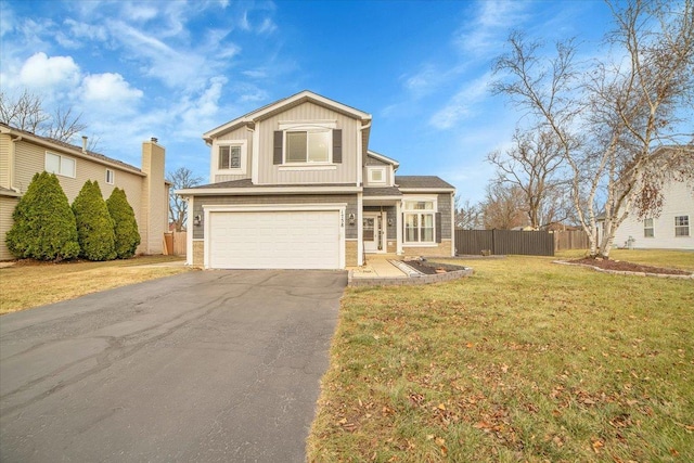 view of front facade with a front yard and a garage