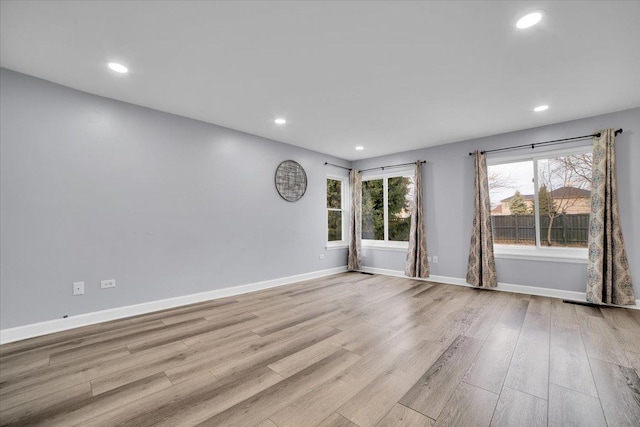 empty room with light hardwood / wood-style floors