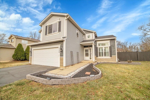 view of front facade featuring a front yard and a garage