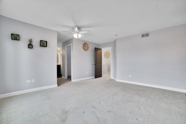 carpeted empty room with ceiling fan