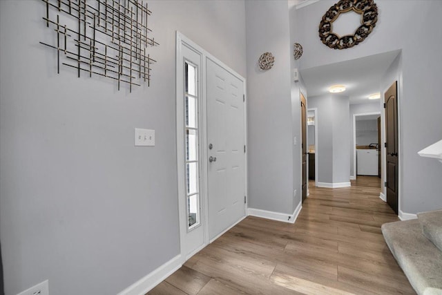 entrance foyer with light hardwood / wood-style flooring