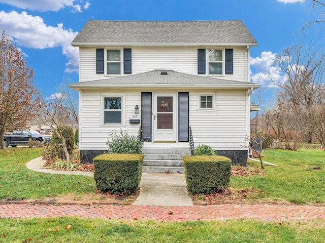 front facade featuring a front lawn