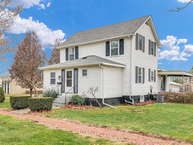 view of front of house with a front yard and central air condition unit