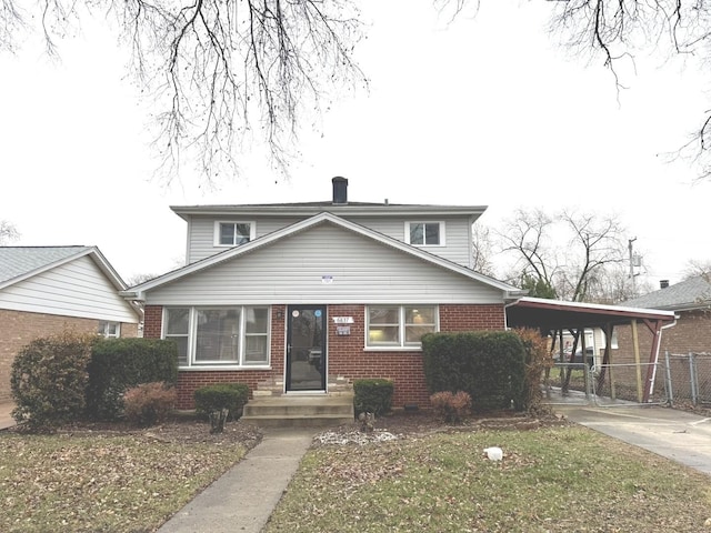 view of front of property featuring a carport and a front lawn