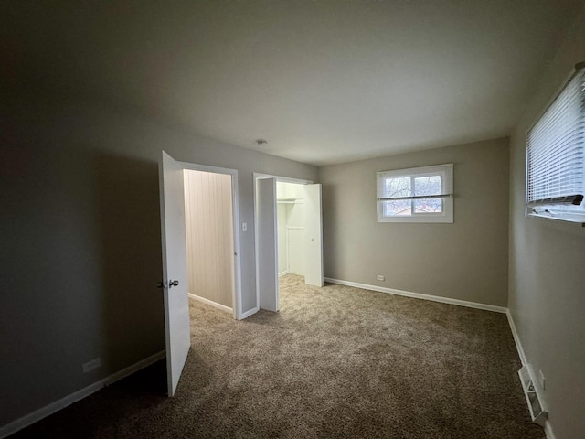 unfurnished bedroom with carpet floors