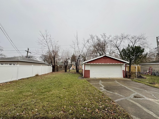 view of yard with a garage and an outdoor structure