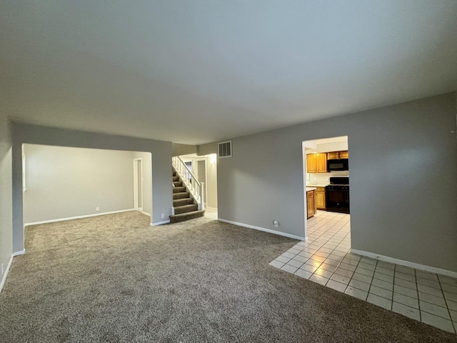 unfurnished living room with light carpet