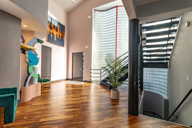 entryway with hardwood / wood-style flooring