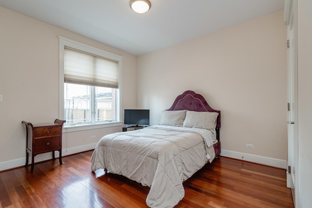 bedroom featuring dark hardwood / wood-style flooring