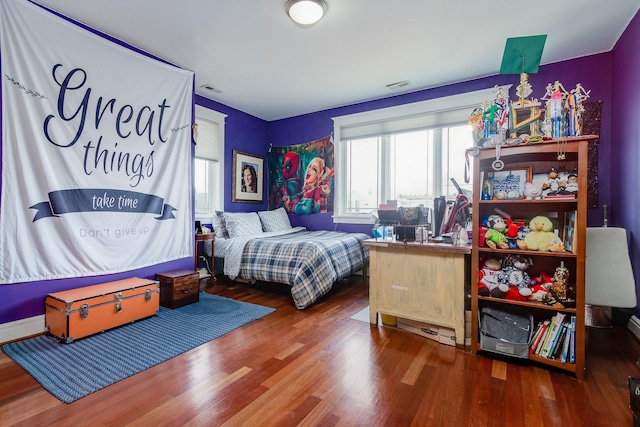 bedroom with hardwood / wood-style flooring