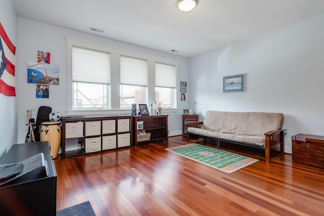 living area featuring hardwood / wood-style flooring and plenty of natural light