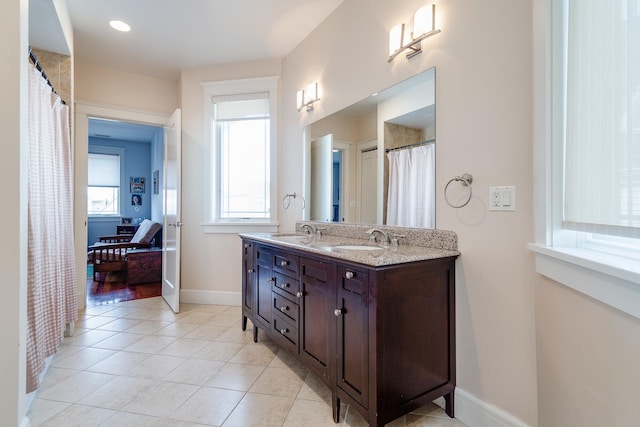 bathroom featuring tile patterned flooring and vanity