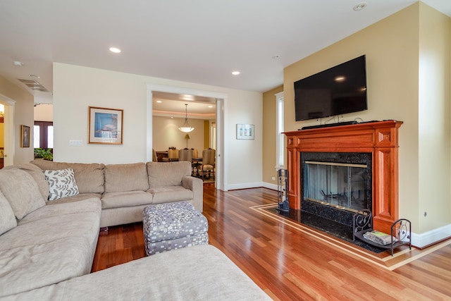 living room featuring a fireplace and dark hardwood / wood-style flooring