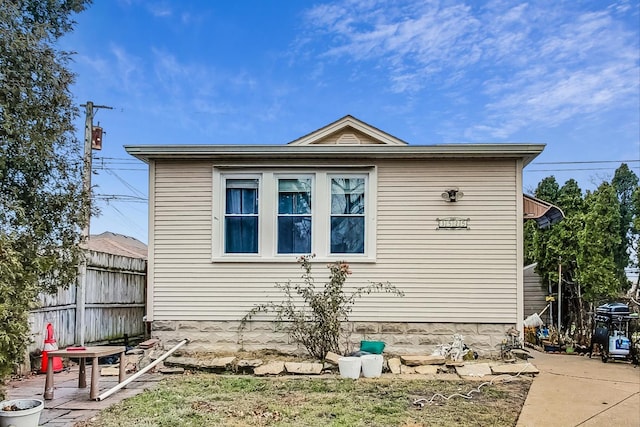 view of side of property with a patio area