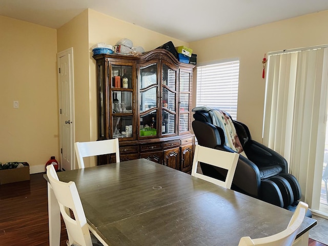 dining room with dark hardwood / wood-style flooring