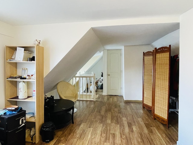 bonus room featuring hardwood / wood-style floors and lofted ceiling