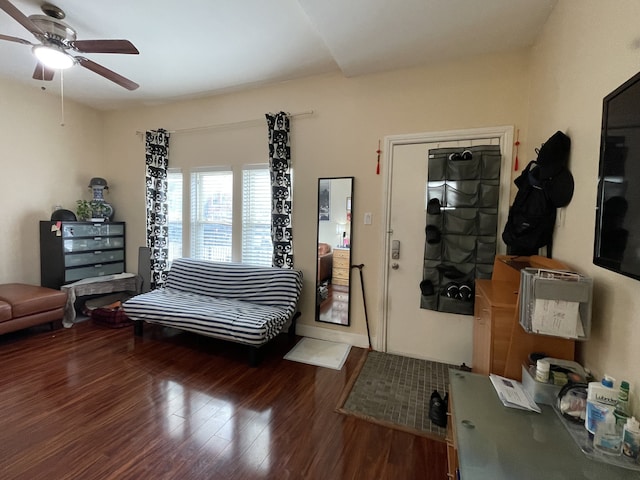 living area with hardwood / wood-style floors and ceiling fan