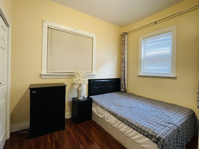 bedroom featuring dark wood-type flooring