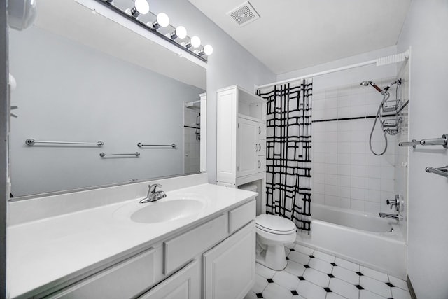 full bathroom with vanity, toilet, and shower / bath combo with shower curtain