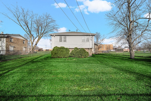 rear view of house with a lawn