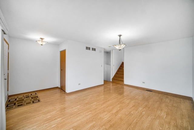 unfurnished room featuring light hardwood / wood-style flooring