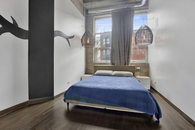 bedroom with hardwood / wood-style flooring