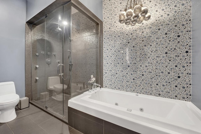 bathroom featuring toilet, an inviting chandelier, independent shower and bath, and tile patterned flooring