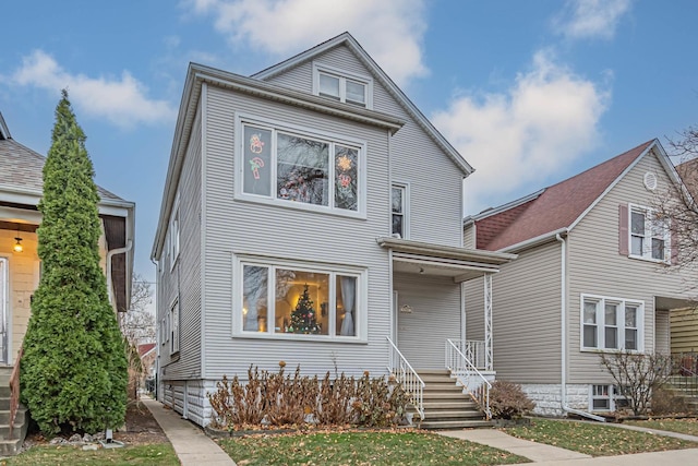 front facade featuring a front lawn