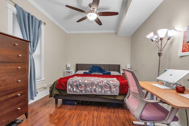 bedroom featuring ornamental molding, dark hardwood / wood-style floors, and ceiling fan