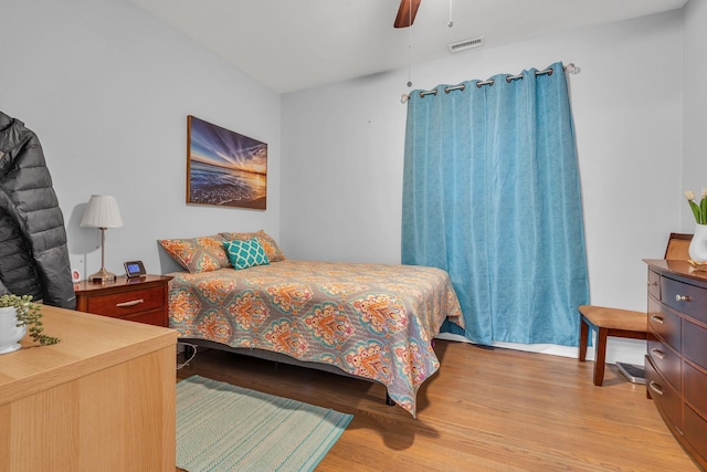 bedroom with ceiling fan and light wood-type flooring