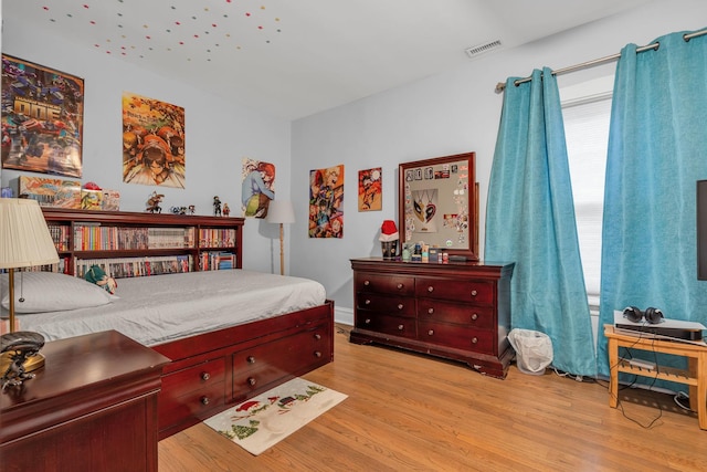 bedroom featuring light hardwood / wood-style floors