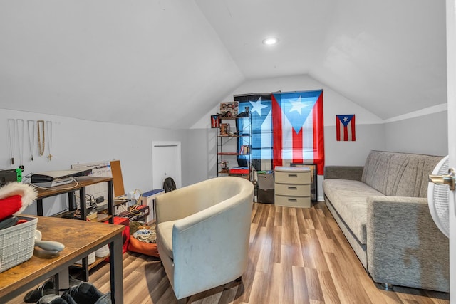 sitting room with light hardwood / wood-style flooring and vaulted ceiling