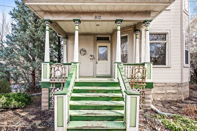 doorway to property with a porch