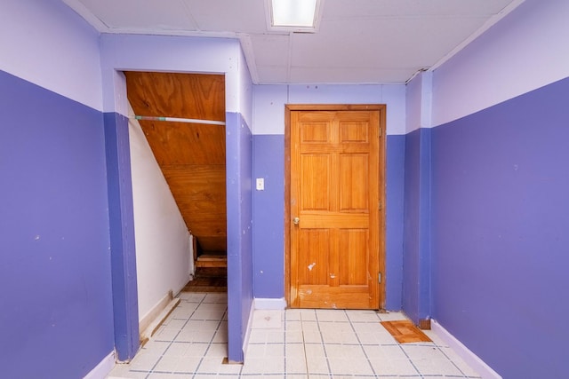 corridor with light tile patterned floors