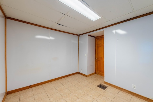 empty room featuring ornamental molding