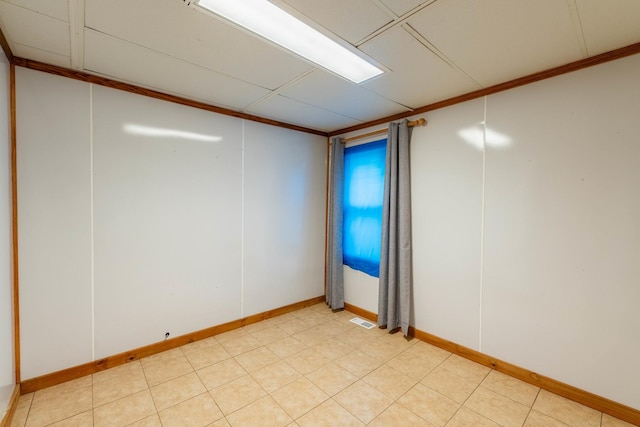 unfurnished room featuring crown molding