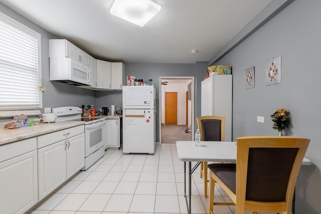 kitchen with white cabinets and white appliances