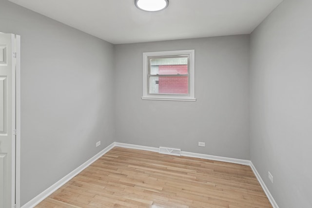 spare room with light hardwood / wood-style flooring