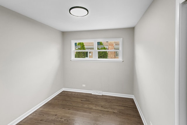 unfurnished room featuring dark hardwood / wood-style floors